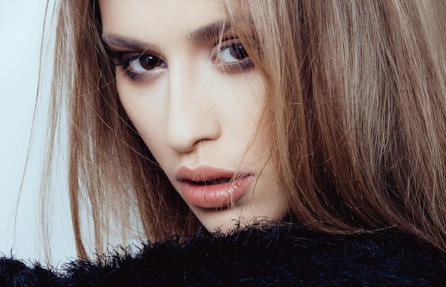 Sleek brunette hair and polished makeup